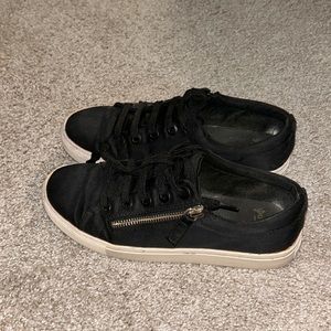 Black low sneakers with gold zipper